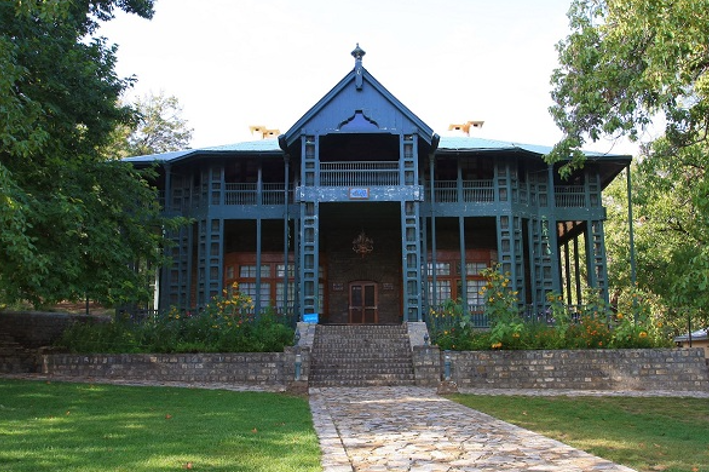 Charred remains of Ziarat Residency after 2013 attack, surrounded by debris