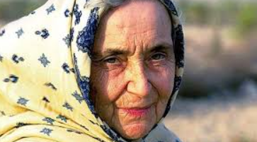Dr. Ruth Pfau comforting a leprosy patient in a clinic.