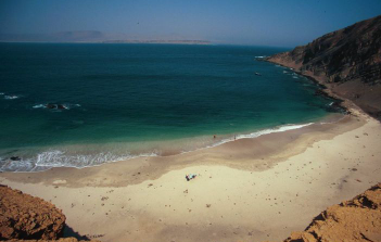 Golden sand dunes meeting the blue waters of the Arabian Sea at Kund Malir Beach, Balochistan.