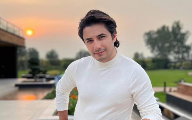 Ali Zafar planting trees during an environmental campaign.