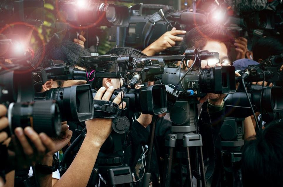 A Pakistani civilian recording a political event for social media