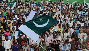 Young Pakistani activists discussing politics using smartphones