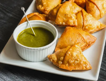  Golden fried potato samosas with mint chutney