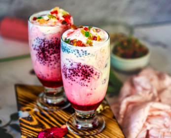 Falooda drink with rose syrup, ice cream, and basil seeds