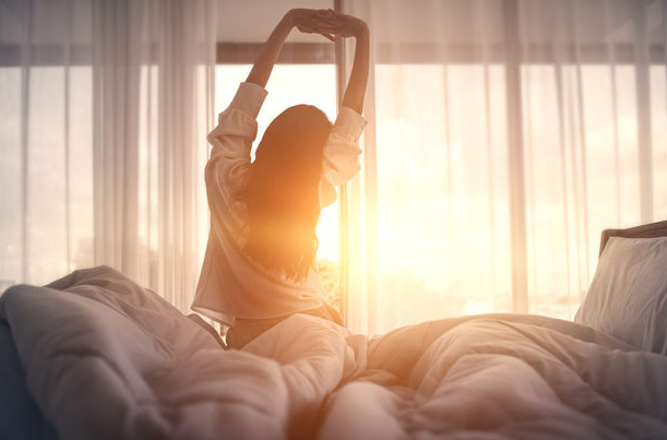 Pakistani mom practicing deep breathing in early morning calm
