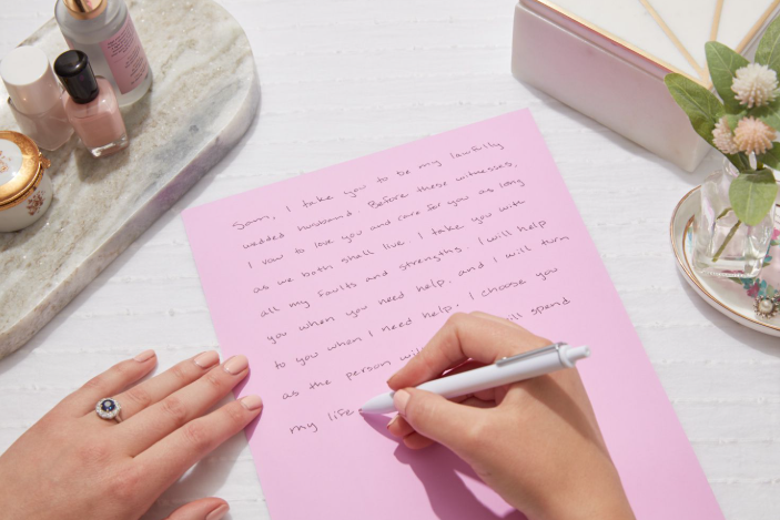 Pakistani mom journaling during a peaceful lunch for self-care