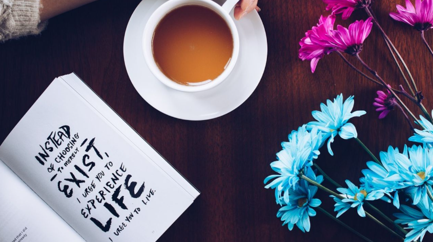 Herbal tea and book for peaceful evening self-care